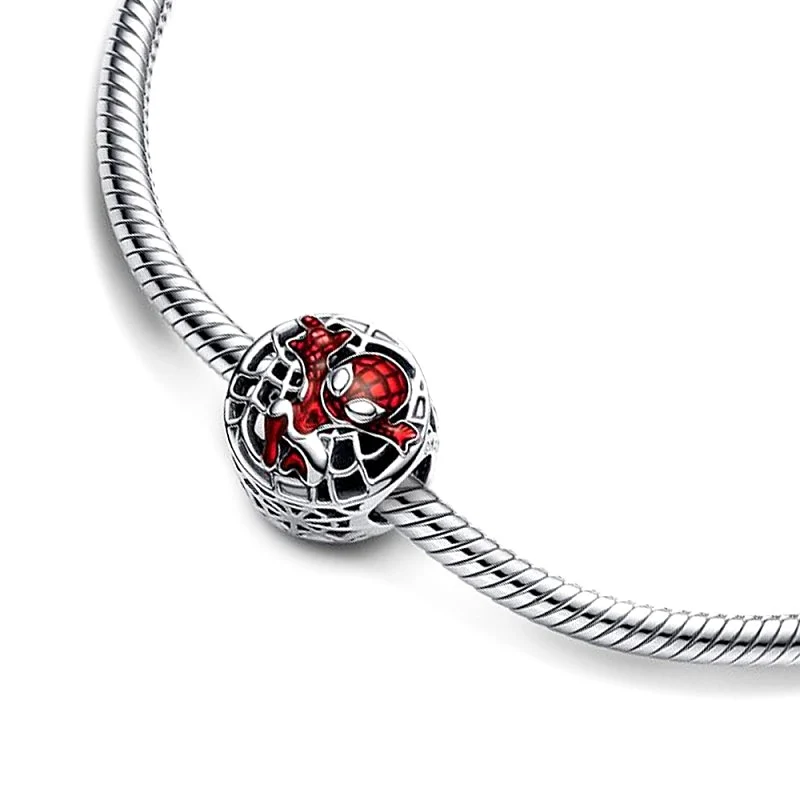 Charms srebrny rodowany spiderman